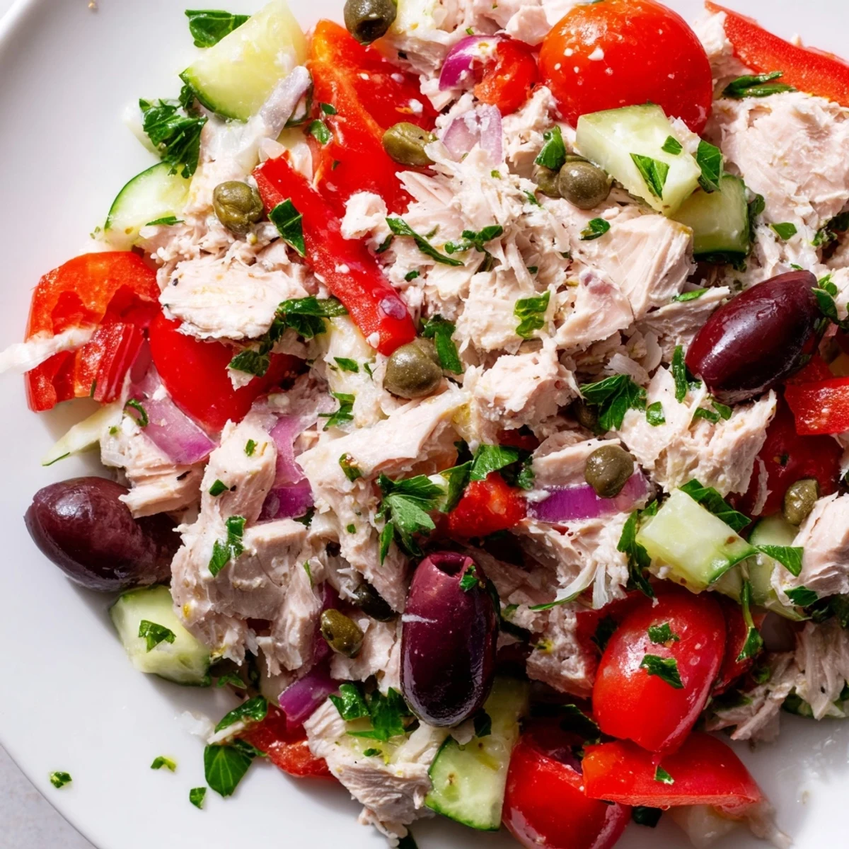Flaky tuna mixed with crisp cucumbers, red peppers, and tangy Kalamata olives