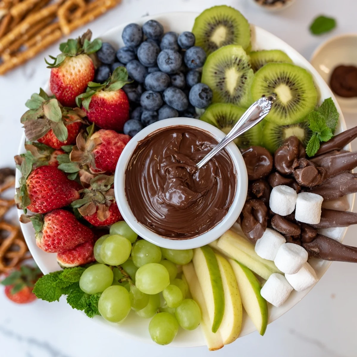 Dessert Charcuterie Board with glossy berries, chocolate bites, and creamy dips.